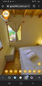 a bedroom with a bed and a window in a room at Cabañas Wairoa Haus 6 ctas sin interés!!!! in Villa General Belgrano +55 photos