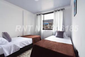 Postel nebo postele na pokoji v ubytování Apartamento Centrico a 30 minutos de Termales + 5 fotografií