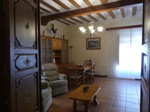 a living room with a table and a dining room at Casa MI LUCÍA in Moratalla +17 photos
