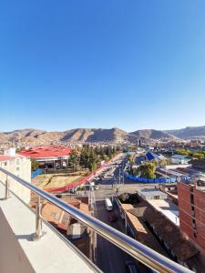 a view of a city with mountains in the background at Suites Cusco in Cusco +83 photos