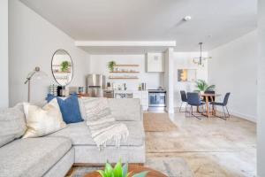 a living room with a couch and a dining room at Studio Bliss Dual-Queen Stay in Vibrant Alberta in Portland +31 photos