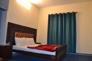 Postel nebo postele na pokoji v ubytování Hotel Pine breeze