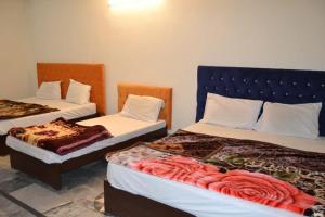 Postel nebo postele na pokoji v ubytování Hotel Pine breeze