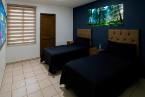 Postel nebo postele na pokoji v ubytování Casa Cómoda con Jacuzzi, Cochera, Terraza y Jardín