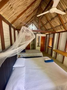 Postel nebo postele na pokoji v ubytování Palma Plata islas del Rosario