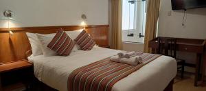 Rúm í herbergi á Saphi Inn Cusco - Excelente ubicación