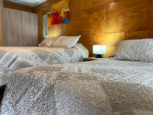 Voodi või voodid majutusasutuse Verdevida Apart Hotel toas