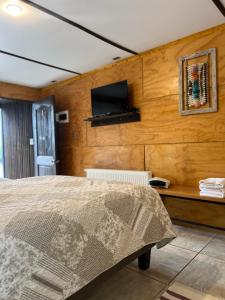 Voodi või voodid majutusasutuse Verdevida Apart Hotel toas