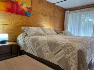 Voodi või voodid majutusasutuse Verdevida Apart Hotel toas