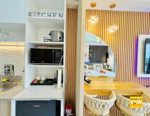 Η κουζίνα ή μικρή κουζίνα στο Solaria Haven Cozy & Family Friendly Studio in Bacolod