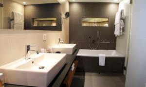 Vannituba majutusasutuses Hotel Allalin Saas-Fee