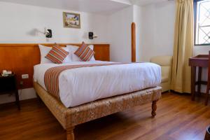 Rúm í herbergi á Saphi Inn Cusco - Excelente ubicación