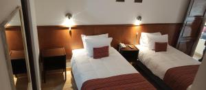 Rúm í herbergi á Saphi Inn Cusco - Excelente ubicación