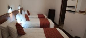 Rúm í herbergi á Saphi Inn Cusco - Excelente ubicación