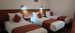 Rúm í herbergi á Saphi Inn Cusco - Excelente ubicación