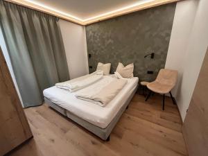 Postel nebo postele na pokoji v ubytování Chalet Kirchberg