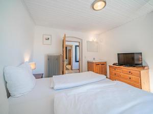 Postel nebo postele na pokoji v ubytování Chalet Kirchberg