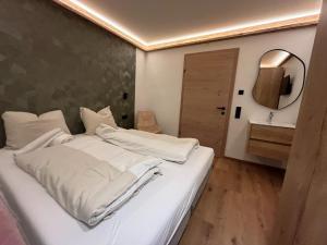 Postel nebo postele na pokoji v ubytování Chalet Kirchberg L