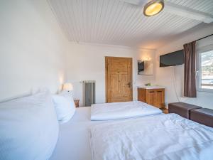 Postel nebo postele na pokoji v ubytování Chalet Kirchberg L