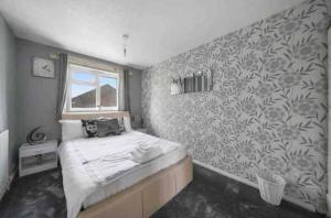 Postel nebo postele na pokoji v ubytování Parkview Manor