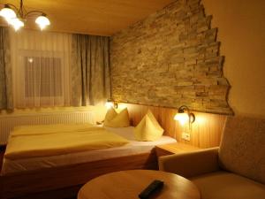 Letto o letti in una camera di Wanderhotel Grüner Baum