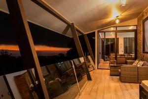 a living room with a view of the ocean at CasaYvyra 'i in Sierra