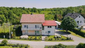 an aerial view of a house with a red roof at Apartments with parking space Lipovaca, Plitvice - 17657 in Rakovica
