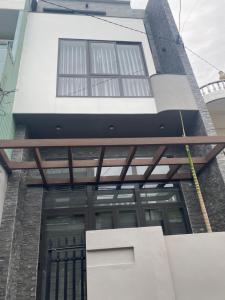 an external view of a house with a building at MầM Homestay in Quy Nhon