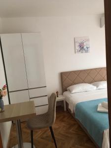 Postel nebo postele na pokoji v ubytování R&A Apartmani Bečići