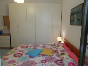 A bed or beds in a room at La Spiaggia sotto Casa A pochi passi dal mare, Rivabella Gallipoli