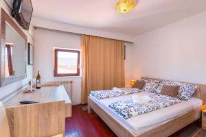 Postel nebo postele na pokoji v ubytování Bed & breakfast La Fontana Medulin