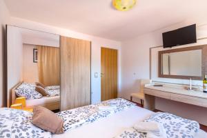 Postel nebo postele na pokoji v ubytování Bed & breakfast La Fontana Medulin