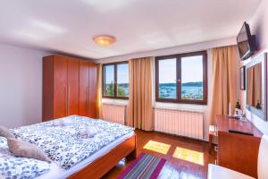 TV a/nebo společenská místnost v ubytování Bed & breakfast La Fontana Medulin