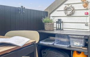 a picnic table with a tableablish at 1 Bedroom Amazing Apartment In Fanø in Fanø