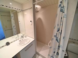 a bathroom with a sink and a shower at Apartment in Durbuy near Ourthe River in Durbuy +24 photos