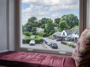 a window with a view of a city street at 4 Harney Peak in Portinscale