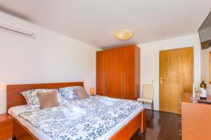 Postel nebo postele na pokoji v ubytování Bed & breakfast La Fontana Medulin