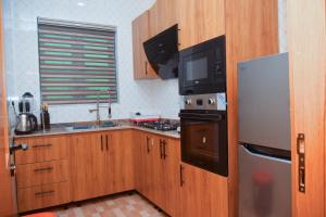 Kuchyň nebo kuchyňský kout v ubytování Radiant Rise Apartments + 37 fotografií