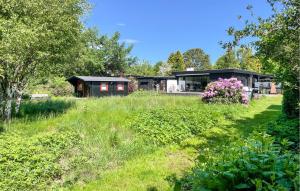 a house in the middle of a field at 2 Bedroom Beautiful Home In Gilleleje in Gilleleje
