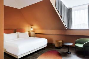 Łóżko lub łóżka w pokoju w obiekcie Mayburg Salzburg, a Tribute Portfolio Hotel