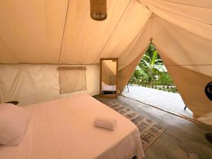 Postel nebo postele na pokoji v ubytování Glamping Jazayma Dentro del Parque Tayrona