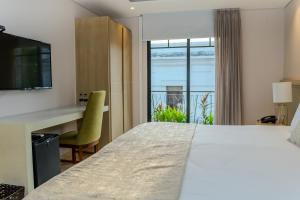 Voodi või voodid majutusasutuse Hotel Boutique Maree toas