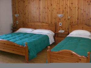 Postel nebo postele na pokoji v ubytování Hotel Villa Ines + 37 fotografií