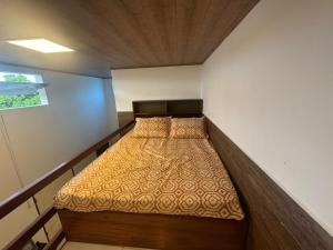 Postel nebo postele na pokoji v ubytování 03 Kitnet próximo da praia com ar-condicionado