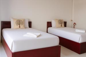 Giường trong phòng chung tại Sipanya Guesthouse +31 ảnh