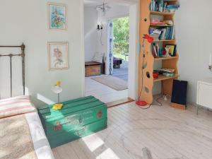 a living room with a box in the middle of a room at Cottage In Woodland Garden In Natural Harmony in Asnæs