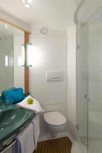 a bathroom with a sink and a toilet and a shower at ibis Namur Centre in Namur