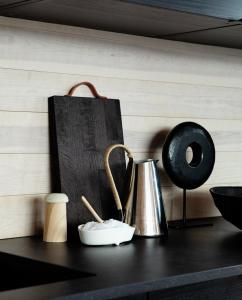 a kitchen counter with a tea kettle and a bag at Architect Cabin With Strandafjellet View in Stranda