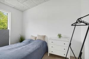 Ένα ή περισσότερα κρεβάτια σε δωμάτιο στο Modern Holiday Home At Sjællands Odde