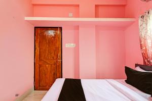 Voodi või voodid majutusasutuse Hotel O MAA BHUASUNI RESIDENCY toas